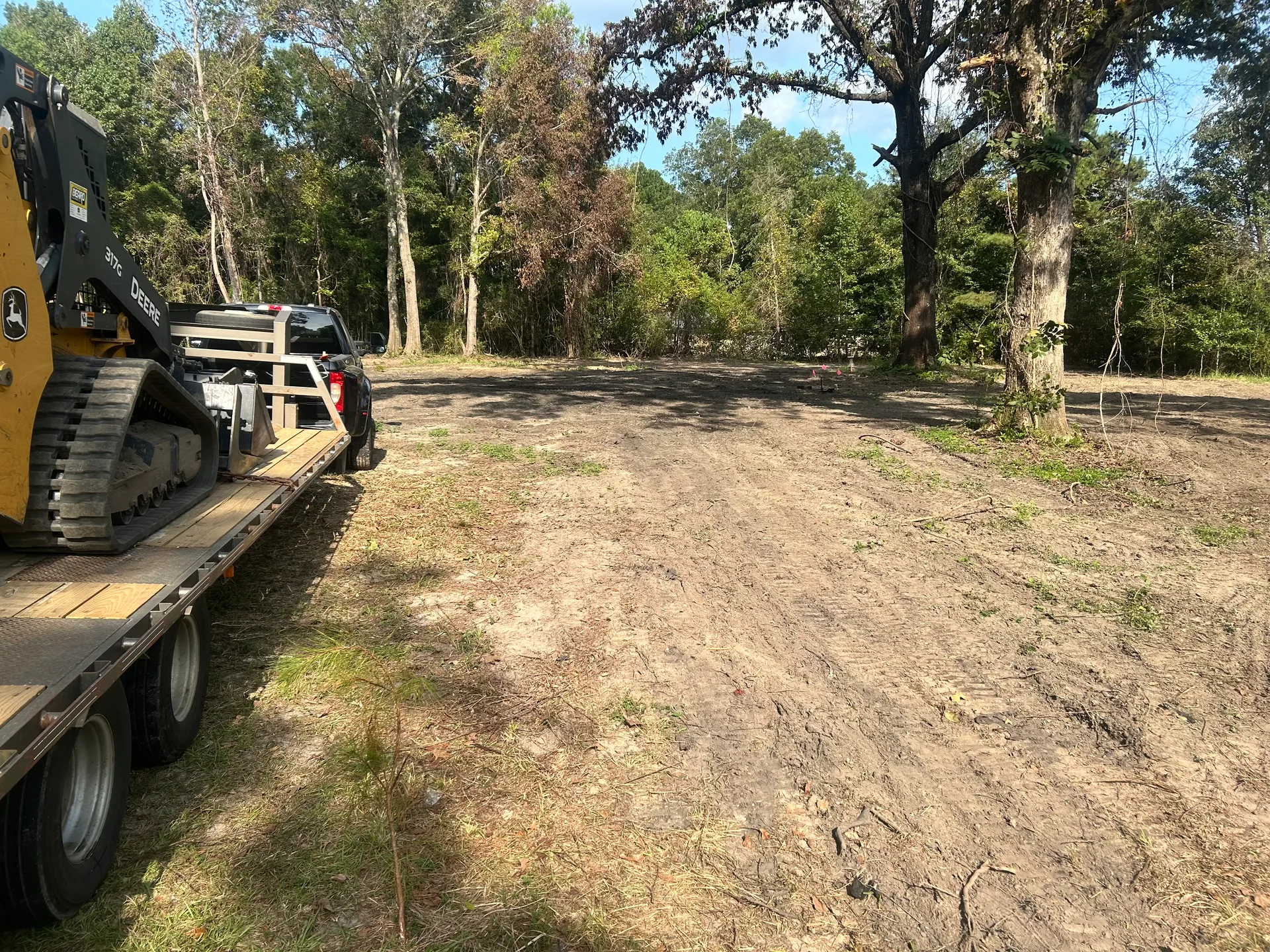 Prepared property with mature trees and All Terrain equipment
